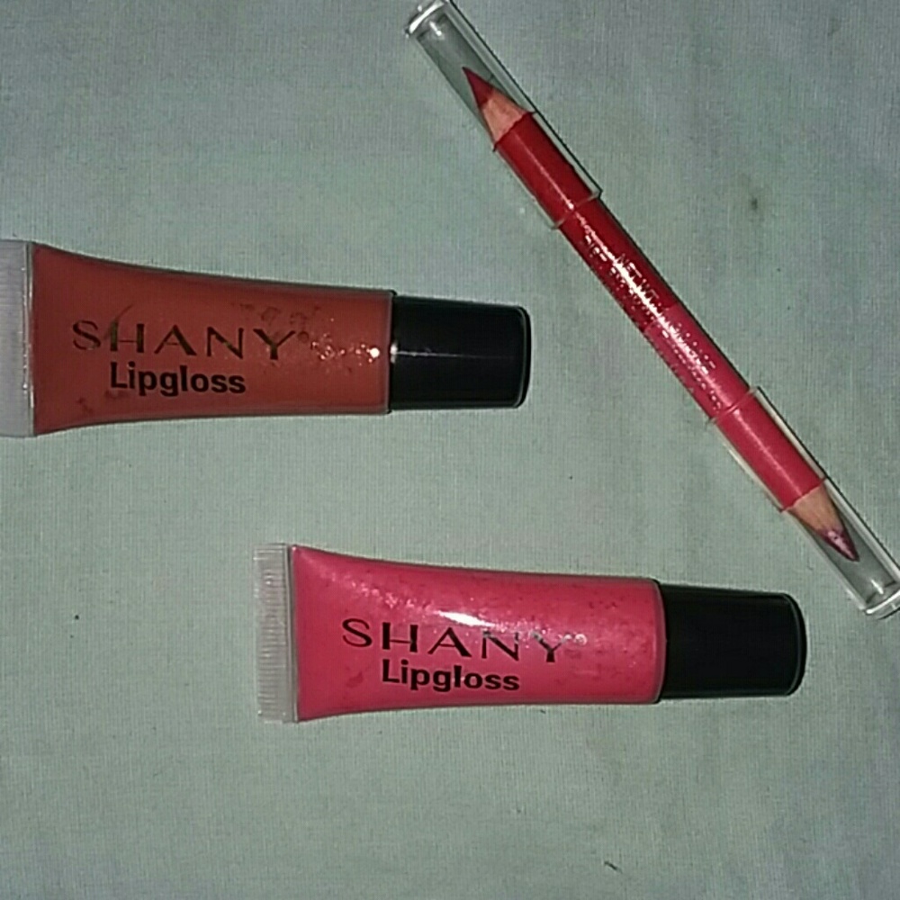 Two lip glosses and a lip pencil
